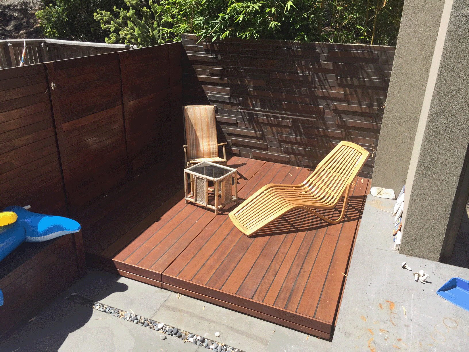 Automated plunge pool cover fully closed and flush with timber deck in Melbourne